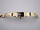 Top-down view of the Michel Herbelin watch with its integrated gold tone bracelet extended.