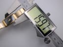 Digital caliper measuring the width of the Michel Herbelin watch case at 19.7mm.