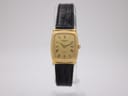 Front view of the Raymond Weil 5744 ladies watch with a rectangular gold electroplated case, champagne dial, and black leather strap.