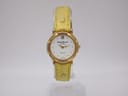 Front view of René Gérard Geneve watch with gold-toned case, white dial, and textured yellow leather strap, displayed vertically.