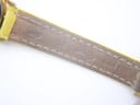 Close-up of the inner lining of the yellow leather strap, showing "HAND MADE" embossed text and stitching details.