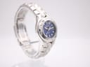 Alternate side profile view of the Bulova Marine Star watch, showcasing the case shape and bracelet links on a clear stand.