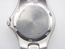 Close-up of the brushed stainless steel case back, with engravings including "Bulova Quartz", "Water Resistant", "Japan Mvt.", "AO Stainless Steel Case".