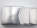 Close-up of the stainless steel bracelet clasp, featuring a raised 'B' logo and a brushed finish.