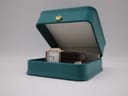 Tissot 21589 watch displayed in an open teal presentation box.