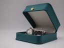 The Tissot PR 516 watch displayed inside a generic green presentation box, suggesting potential gift presentation.