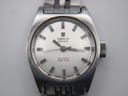 Close-up of the silver dial of the Tissot PR 516, showing applied baton indices, hands, and 'AUTOMATIC PR 516' text.