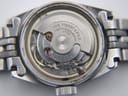 Detailed view of the Swiss automatic movement inside the Tissot PR 516, showing the rotor, twenty-one jewels, and 'CHS. TISSOT & FILS' engraving.