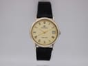 Front view of Continental 357 watch with cream dial, gold-tone Roman numerals, and black textured leather strap.
