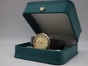 The Continental watch with its black leather strap, displayed neatly inside a green presentation box with a gold crown emblem.