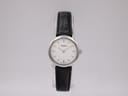 Front view of the Tissot C226K ladies watch with a white dial, baton indices, and a black leather strap.