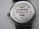 Close-up of the stainless steel case back of the Tissot C226K, showing engravings 'WATERRESISTANT 30M', 'LAUSANNE', 'TISSOT 1995', 'C226K', 'STAINLESS STEEL', and 'MINERAL GLASS'.