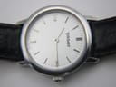 Macro close-up of the Tissot C226K's white dial, highlighting the applied baton indices, minute track, and 'SWISS MADE' text at the bottom.