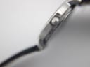 Close-up of the fluted crown on the side of the Tissot C226K watch case.