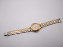 Overhead view of the entire Bulova watch with its two-tone bracelet extended.