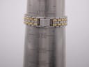 Watch bracelet wrapped around a wrist sizing gauge, indicating a circumference of 14.5 cm.