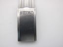 Close-up of the stainless steel fold-over clasp, clearly showing the "SEIKO" logo engraving.