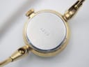 Close-up of the watch case back, showing the serial number "3222" engraved on the brushed stainless steel.