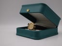 Westar gold-toned watch in a green presentation box.