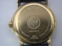 Close-up view of the Raymond Weil 9972 case back, showing engravings for "18K Gold Electroplated 10M", "Swiss Made", "Sapphire Crystal", "Water Resistant 3 ATM", serial number D 003256, and model 9972.