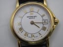 Detailed close-up of the Raymond Weil 9972 white dial with raised gold Roman numerals, dot indices, the RW logo, 'Raymond Weil Genève' text, and a date window at 3 o'clock.