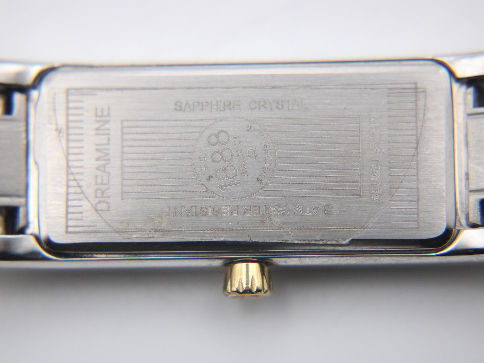 Close-up of the Roamer Dreamline case back, showing sapphire crystal and 3 ATM water resistance markings with protective film.