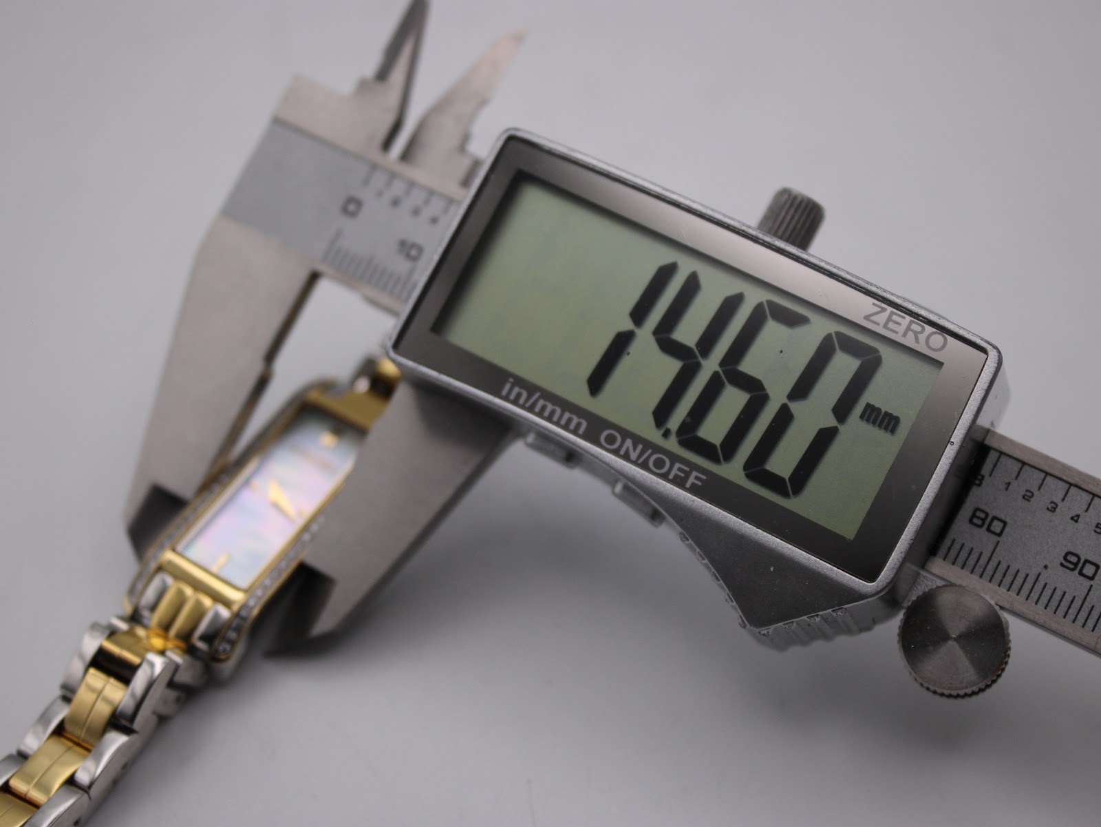Digital caliper measuring the case width of the Roamer Dreamline watch at 14.60mm.
