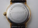 Close-up of the stainless steel case back of the Tissot C225K, showing "Waterresistant 30M", "Tissot", "Mineral Glass", "Stainless Steel", and model "C225K".