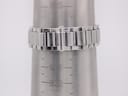 Close-up of the integrated stainless steel bracelet of the Gucci 7700 M watch on a wrist sizing gauge, showing it fits a wrist of approximately 183mm / 18.3cm.