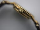 Close-up of the watch crown, showing a subtly signed 'GG' logo.
