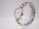 Side profile view of the Bulova watch on a clear stand, showing the crown.