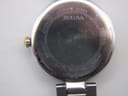 Close-up of the watch case back, showing "sapphire glass", "Bulova", "water resistant", "stainless steel" and model number.