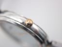 Macro shot of the Bulova watch crown, featuring the distinct tuning fork logo.