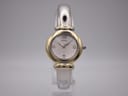Front view of Michel Herbelin 16836.B two-tone watch with silver dial, gold-tone bezel, and integrated silver-tone bangle.