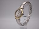 Angled view of Michel Herbelin 16836.B watch showing two-tone case, silver dial, and integrated bangle bracelet.