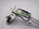 Digital caliper measuring the Tissot L820P case, displaying a precise width of 14.39 mm.