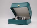The Tissot L820P watch resting inside a teal presentation box with a gold crown emblem on the lid.