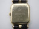Close-up of the watch case back showing 'PATENTED MODEL', 'RW' logo, 'RAYMOND WEIL', '10M', '9014-5', and '18K GOLD ELECTROPLATED' engravings.