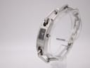 Angled side view of the Gucci 6100L watch, highlighting the profile of the case and the polished finish of the stainless steel.