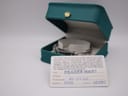 Original Gucci warranty card inside a teal Gucci box, showing the model number, serial number, and purchase date of 30-07-2002.