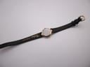 Back view of Certina watch on black leather strap showing generic buckle and strap branding.