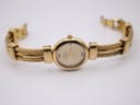 Front view of the Michel Herbelin watch with the two-tone bracelet unclasped, showing its full length.
