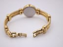 Rear view of the watch with the bracelet unclasped, showing the clasp mechanism and case back.