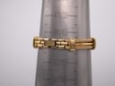 The watch bracelet measured on a wrist sizing cone, showing a circumference of 14.5cm.