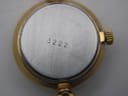 Close-up of the watch's case back, revealing the serial number '3222' engraved on the brushed steel centre.
