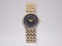 Front view of Manin Cartear two-tone quartz watch with black dial and gold Arabic numerals.