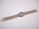 Full view of the Manin Cartear watch with the two-tone steel bracelet extended.