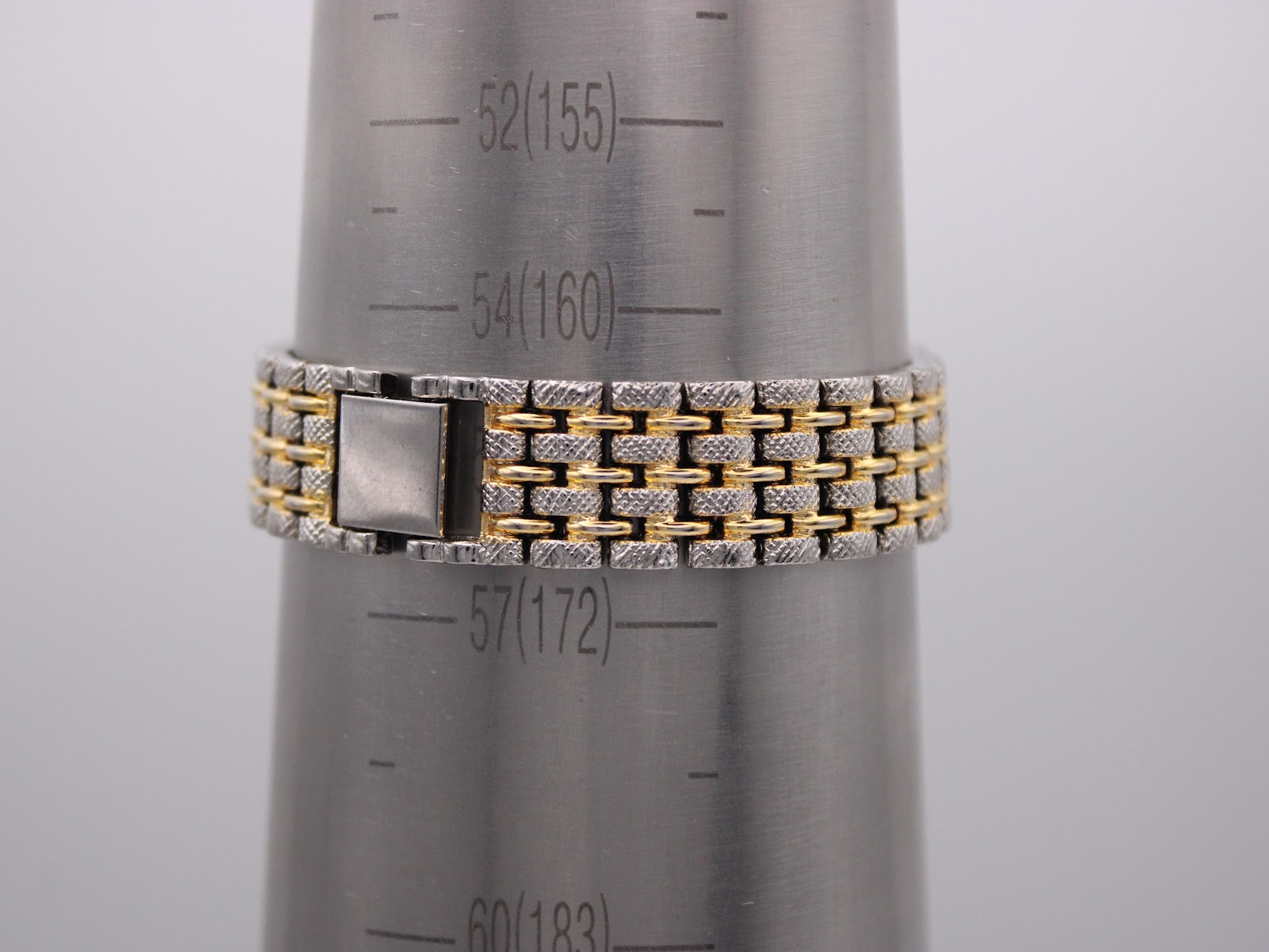 Watch bracelet on a wrist sizing gauge, showing a circumference of 160mm.