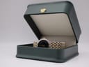 Manin Cartear watch displayed in a green presentation box.