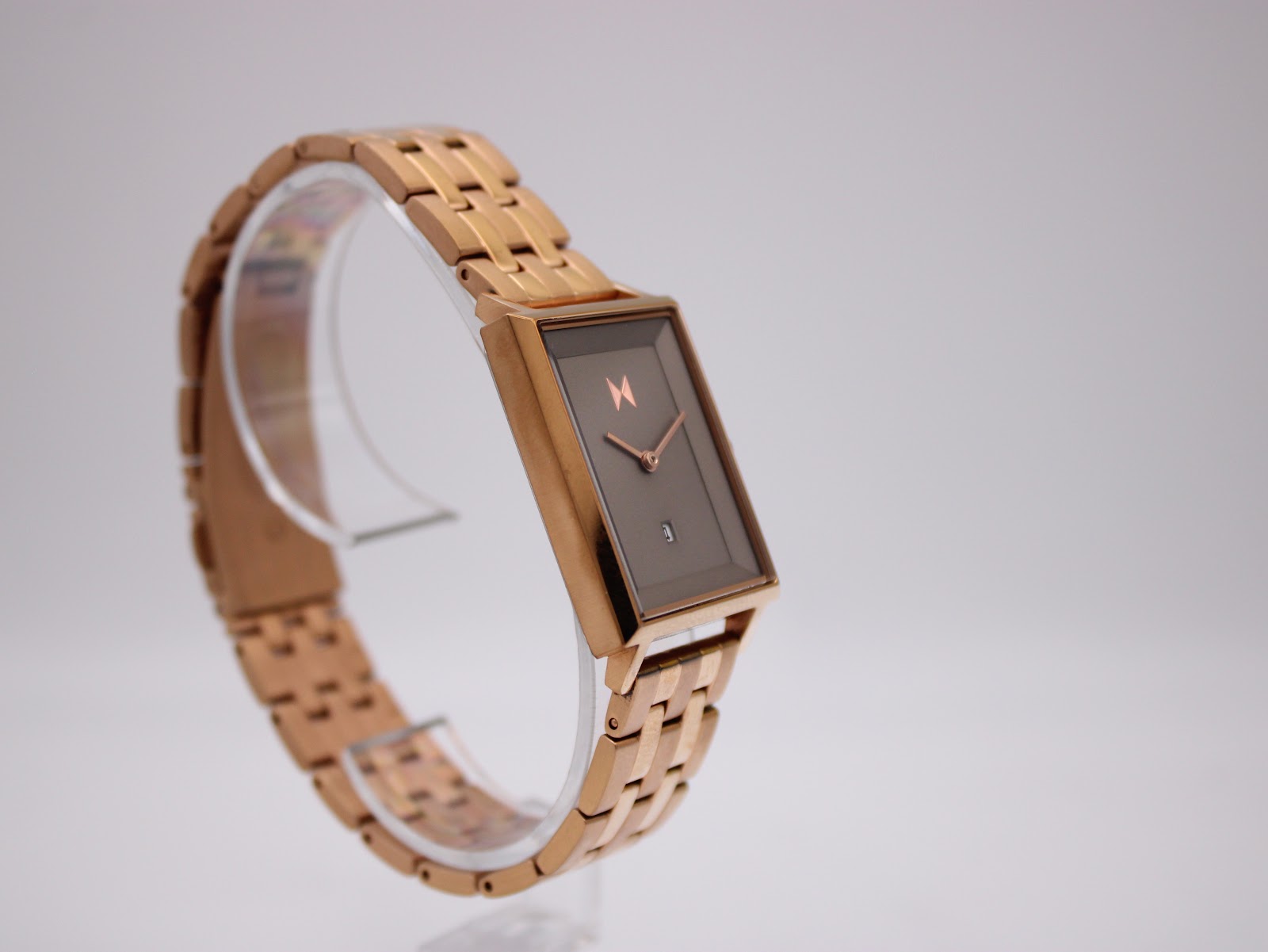 Oblique view of the MVMT Signature Square watch highlighting the minimalist dark brown dial and rose gold tone hands.